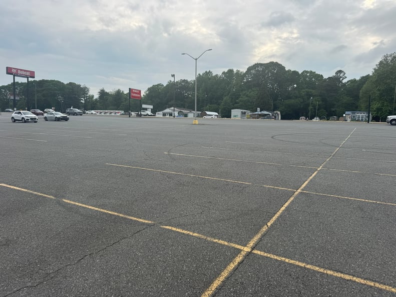 Signs its time to sealcoat your asphalt parking lot in NC