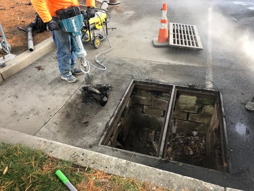 <img src="before-catch-basin-repair.jpg"  alt="Failing parking lot catch basin and cracked sewer cleanout cap before repair at commercial property in New Jersey"  title="Before: Catch basin failure – FixAsphalt.com" />