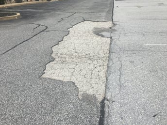 paving_over_cracked_asphalt.jpeg